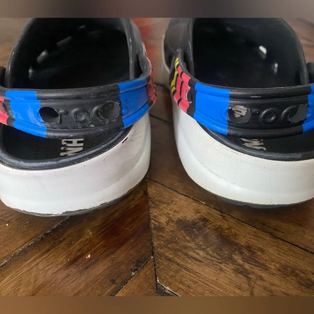 CROCS Kids Black Clogs with Blue and Red Accents